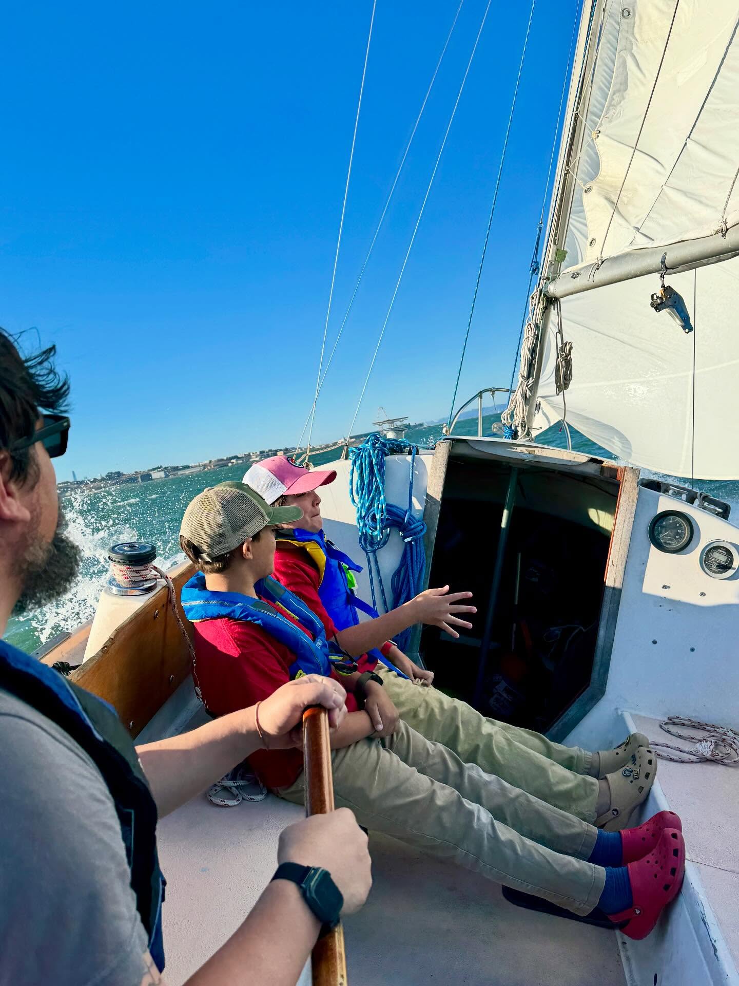 Scouts enjoying an evening on the water aboard the troop’s sailing boat, Whitecaps